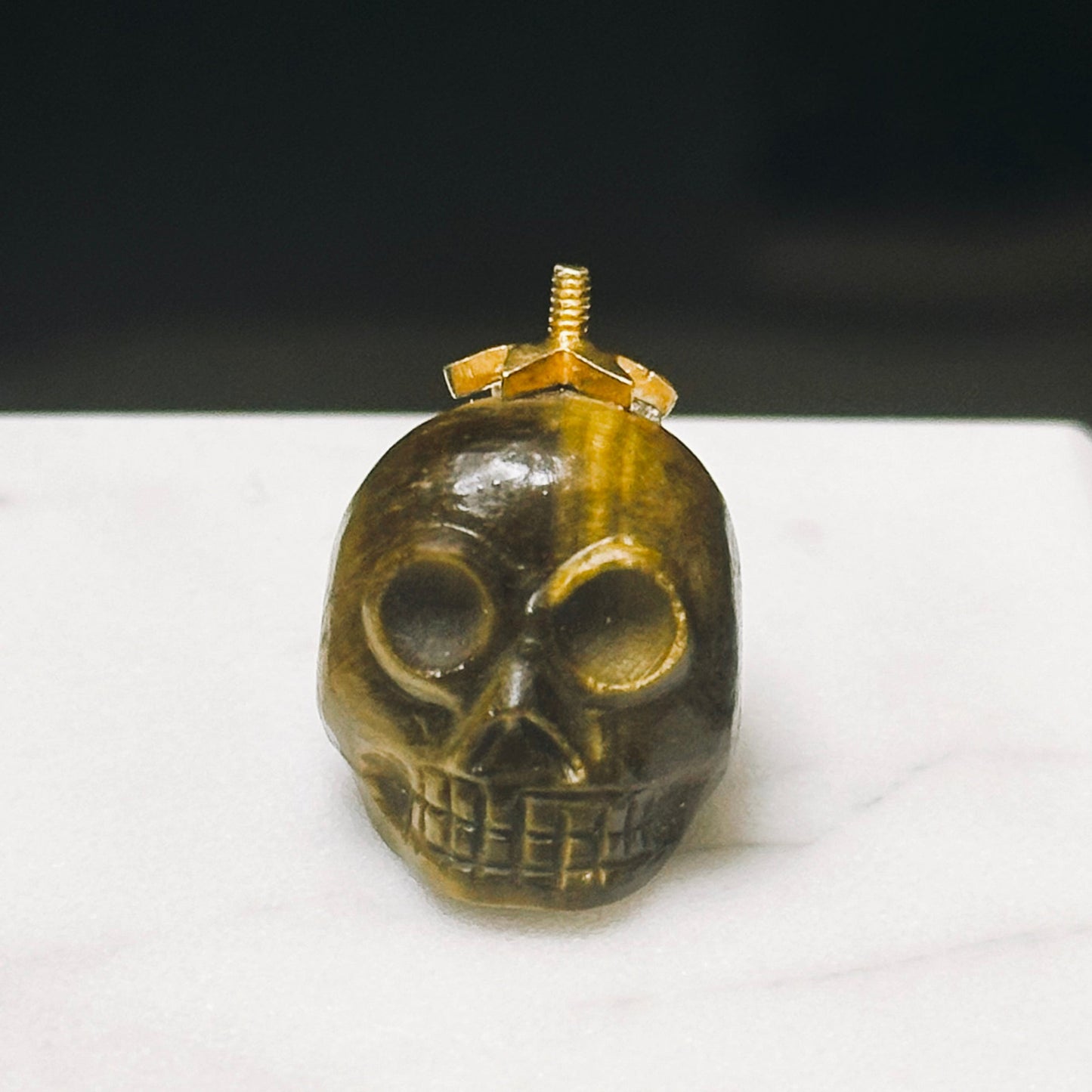 MERKABAH tiger eye skull pendant